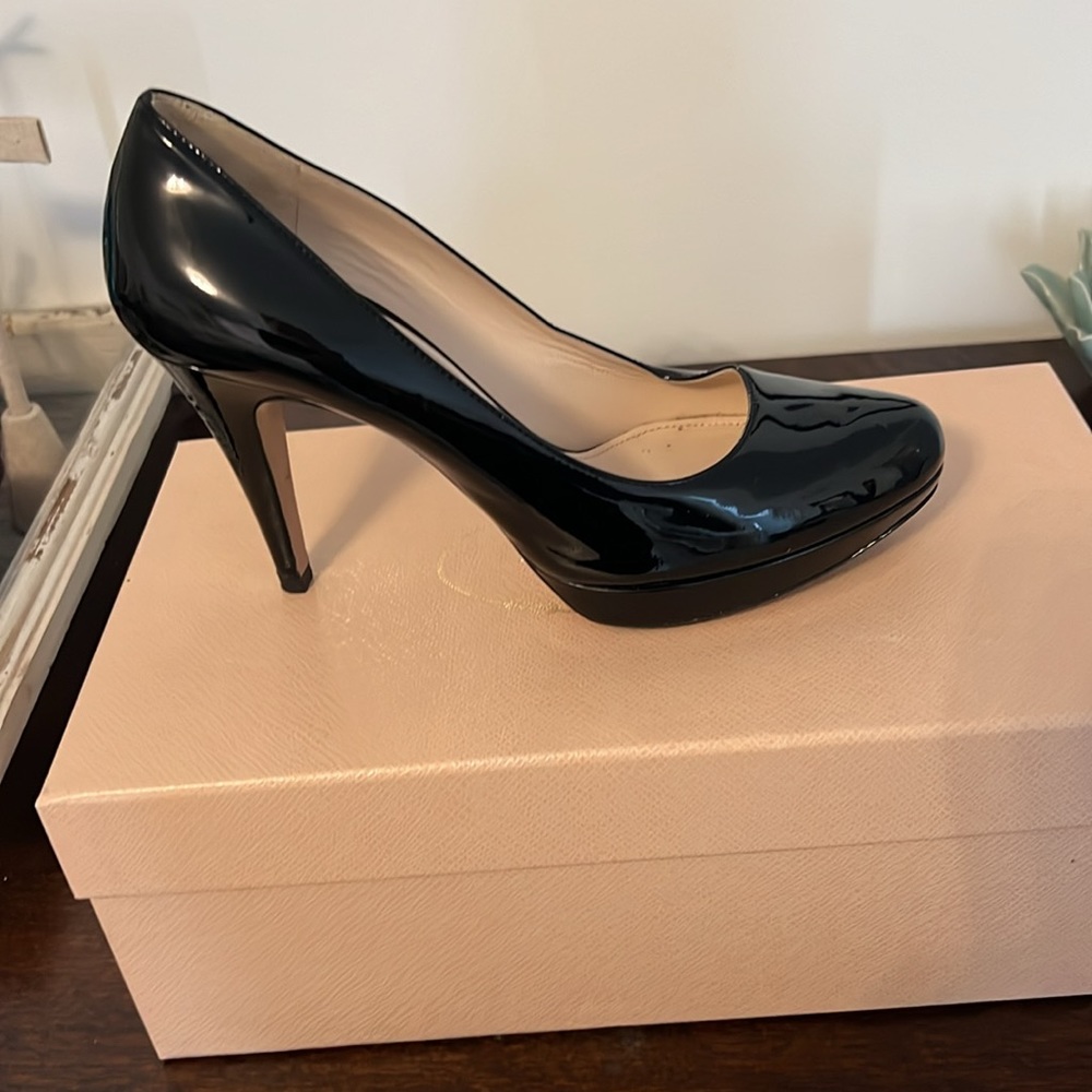 Prada black patent leather heels. Excellent condition. Includes dust bag.
